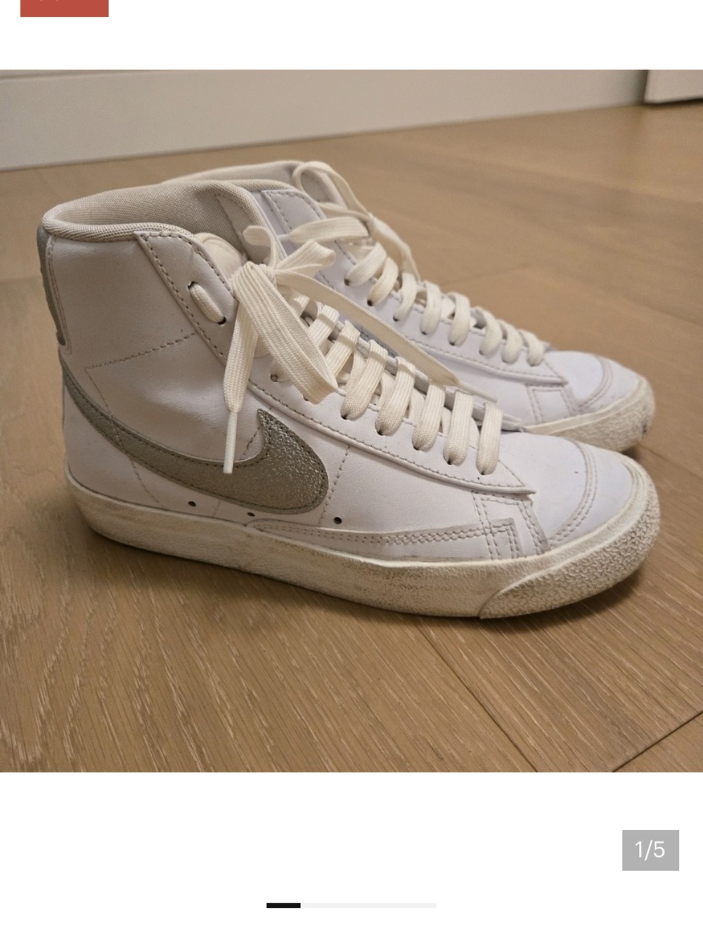 Nike White High-Top Sneakers with Silver Swoosh